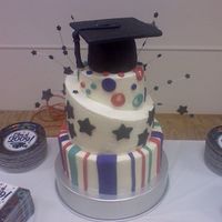 Combo Grad Cake! 4 tier vanilla and chocolate cake. Buttercream frosting with fondant decorations. I had soo much fun/stress doing this cake!