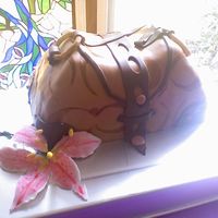 My Very 1St Purse Cake Coconut cake with coconut creme filling and covered with coconut buttercream/fondant.