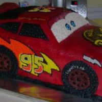 Lightning Mcqueen This cake had some issues. After it was carved and frosted the back end fell off. It was reattached and supported with styrofoam (the part...