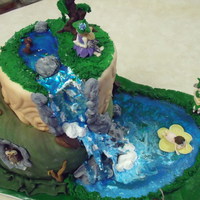 Fantasy Fairies Fairies made with gum paste/fondant cake covered in mmf, water homemade piping gel.