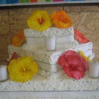 Hawaiian Theme Carrot Cake BC frosting on Carrot Cake. Hibiscus flowers made of gumpaste