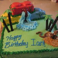 124292740132414.jpg Indiana Jones Lego cake made with fondant and BC. The legos made of rice krispy bars and oreos covered in fondant, trees are made of...