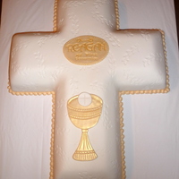 Embossed Cross Made with the large Wilton (2 cake mix) cross pan. MMF embossed with a leaf stamp and then placed on cake.