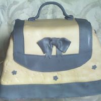 Purse Cake Mothers Day 2008 This is a purse cake I patterened after a cake I had seen elsewhere. It is all fondant. This cake sat on the gift table for hours before...