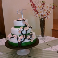 Cherry Blossom Green Ribbon Wedding Cake First Wedding Cake I have made. Fondant cake - Cherry Blossoms with green ribbon.