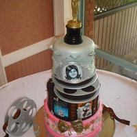 "hooray For Hollywood" Entire cake is edible and is made up of either cake or sugar.Movie posters and B&W portrait are hand painted with food colorings....
