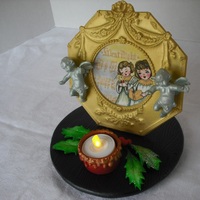 "silent Night-Holy Night" This was made for the window display of a jewelry store.All gumpaste, and the painting with the "Silent Night" music was done...