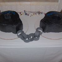 Police Handcuffs This is not a good picture because the cake coloring came out really dark (see other picture for better coloring). Anyway, this is the...