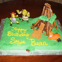 Shrek 4 Rainbow bit cake with vanilla bc and chocolate bc for the house. Pretzel bark and roots. Figures were from McDonalds.
