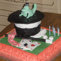 Magic Birthday Cake This was for a little boy turning 7. They were having a magician at the party but he wanted a dinosaur on the cake too, so this is what I...