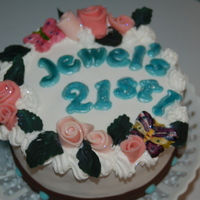 21St Birthday Fondant Cake Oreo cream butter cream filled, fondant covered with tutti frutti flavored letters, fondant roll roses, butterflies and chocolate ribbon...