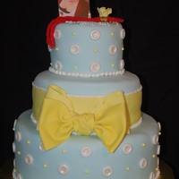High School Graduation Bow Cake 3 tie( 12",8", 6") white chocolate cake with white chocolate ganache filling, middle layer butter cake with bavarian cream...