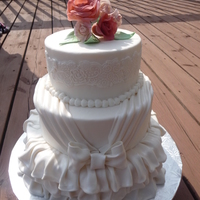 Wedding Cake 6, 8, and 10 inch cakes. Covered and decorated with fondant.