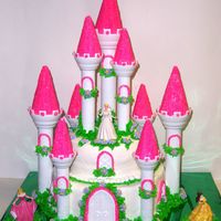 Castle Cake This cake was made for my grandaughter's 7th Birthday. I used the Wilton castle kit and buttercreme frosting.