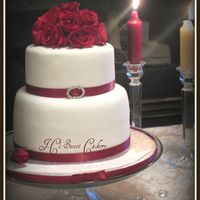 Ruby Anniversary Small 8 & 6", top vanill w/lemon, bottom marble. Satin ribbon & small broch, real roses on top...stuck them into a ball of...