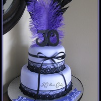 Purple Passion 9" & 6", strawberry shortcake & chocolate w/buttercream. Covered in MMF w/lace & feathers. TFL