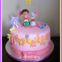 Dora 8" vanilla w/cookies & cream filling. Gumpaste butterflys/explorer stars/#3. Plastic figures. Fun to make:) TFL