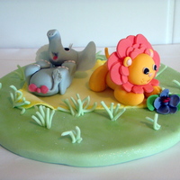 Frolicking Just a bit of experimenting.Fondant baby elephant & lion having a play.