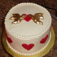 Lovebirds Cake Buttercream icing with fondant accents and painted gold fondant birds