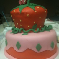 Strawberry Shortcake Vanilla cake with fresh strawberry frosting filling, covered in fondant.
