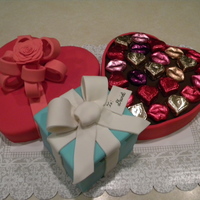 Candy And Gift Box Yellow cakes covered in fondant with fondant accents. The customer bought the candies she wanted for the candy box. The cake gift box is...