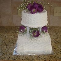 White Wedding With Purple Flowers this was just a basic basketweave. I added purple tulips and baby's breath to match brides bouquet. Very simple, I did it for a friend...