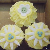 Whimsical Garden Baby Shower Cupcakes These are lemonade cupcakes with vanilla buttercream frosting and fondant flowers. The flowers were made to match the nursery bedding which...