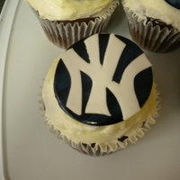 New York Yankees Cupcakes Chocolate cupcakes with cream cheese frosting and hand cut Yankees emblems for my sons tball team. I cut a disk of white fondant and...
