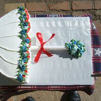 Red, White, & Blue Shower This cake is a 10" round halved. White cake with rasberry filling, buttercream icing. 100 royal icing apple blossoms in blue and lt....