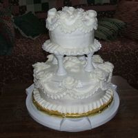2 1/2 Hour White Wedding This cake was done as a demo for a wedding event over a period of two and a half hours. It's a white cake with rasberry filling with...