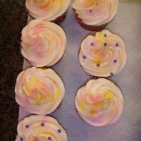 Easter Cupcakes... Yellow cake with BC icing... Yellow and Pink sparkle dust added!!!