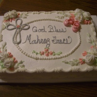 Baptism Cake WASC with buttecream icing. Little shoes are made from gumpaste.