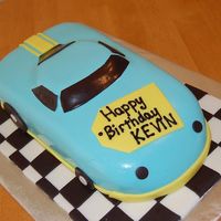 Fondant Racecar Cake. My first attempt at using fondant to cover a shaped cake.