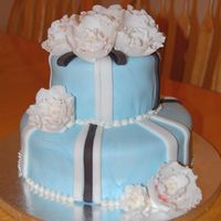 2-Tiered Cake Covered In Fondant And Fantasy Flowers This is my first attempt at a tiered cake and fantasy flowers.