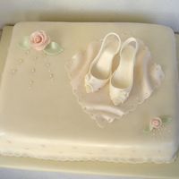 Shoe Cake Fondant covered cake with fondant shoes and roses. All hand-made. TFL.