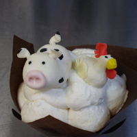 Marzipan Cow And Chicken On Bananas Foster Cupcake 