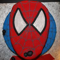 Superhero Spiderman Spiderweb Cake 2 tier cake. On the top I shaped the cake as Spiderman's head covered in red fondant. Bottom tier covered in blue fondant with...