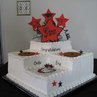 3 Step Graduation Cake - Sports Theme 3 step 2 layer 12" cake with gumpaste topper, stenciling, buttercream transfers of basketballs and Bulldog mascot