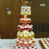 Cupcakes And Fondant Wedding Cake Top cake is fondant. Cupcakes with buttercream and gumpaste hearts.