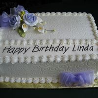 50Th Birthday Cake For A Female Buttercream smoothed over 2 7x11" layers. Impression mat used on sides and part of top. Purchased gum paste flowers from GSA with...