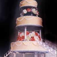 Wedcake2.jpg My first ever wedding cake. I waited in the hot sun for hours for the banquet hall to open... the bride & groom showed up and the hall...