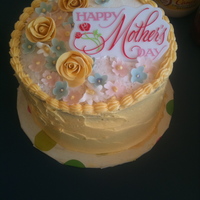 Mother's Day Cake Yummy Tres Leches cake, with buttercream filling and icing. Flowers made out of gum paste.