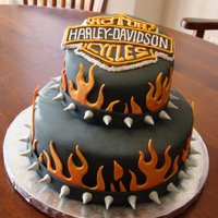 Harley Davidson Birthday Cake Two tier Harley Davidson cake; the first cake I ever made out of my own home instead of out of a bakery. I was nervous about that, but it...