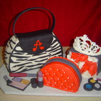 Got Purse, Make Up, Shopping Gag?! Pound cake covered in MMF, accents are made from MMF as well. Tiara is made from royal icing which I found the instructions here on cake...