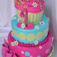 Colorful Cupcake 1St Birthday This cake was for my very old friends duaghters 1st birthday. The cupcake on top was the smash cake. This is one of my favorite cakes I...