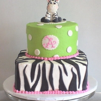 Baby Zebra Stacked 8" square and 6" round for a dear friend's baby shower. The cake was designed to coordinate with the invitations and...