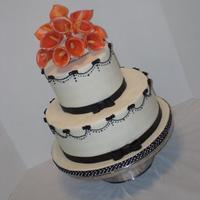 Alyson My first wedding cake! It's small but I'm pretty happy with how it turned out. 10" and 6" rounds covered in buttercream...