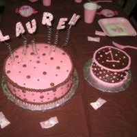 Lauren's Cake Large cake is strawberry marble with pink buttercream ans small cake is chocolate with chocolate buttercream. Letters are gumpaste.