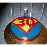 Super Man 30Th Cake made for my hubby's 30th, chocolate cake with white chocolate ganache coloured blue, the symbol was made of fondant, but the colours...