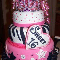 Sweet 16 This is a 3 tiered cake I made for a sweet 16 party. It's white cake filled with buttercream and covered in fondant.